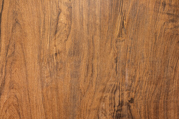Background and texture of dark brown hardwood or oak wood surface in natural pattern. Close-up and...