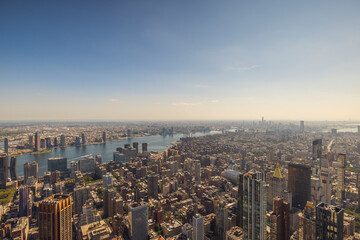 A bird's-eye view of the Manhattan skyline, featuring the Hudson River and skyscrapers. New York....