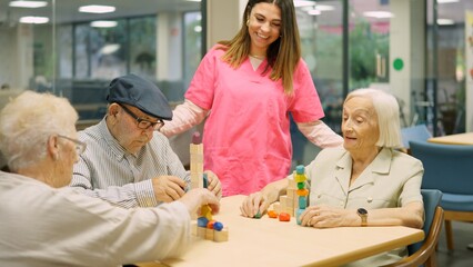 Friendly and funny nurse talking to senior people