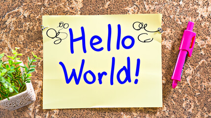 Photo of the text "Hello World!" written with a marker on a sticky note
