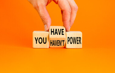 You have or not power symbol. Concept word You have or have not power on beautiful wooden cubes. Beautiful orange table orange background. Business and you have or not power concept. Copy space.