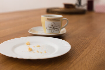 Fototapeta na wymiar Empty plate and coffee cup after breakfast