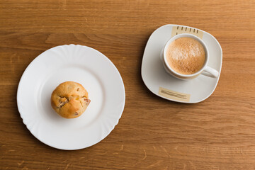 Fresh muffin with coffee for breakfast