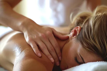 Fototapete Massagesalon a woman getting a back massage at spa