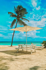 Beach chairs, umbrella on the sandy beach near the sea. Summer holiday