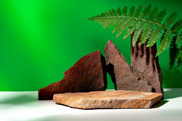 Stone display for product against green background