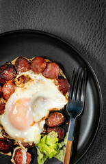 Fried egg and sliced sausage.