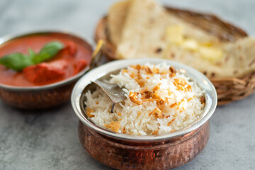 Smoky white rice. Prepared and served in a brass bowl
