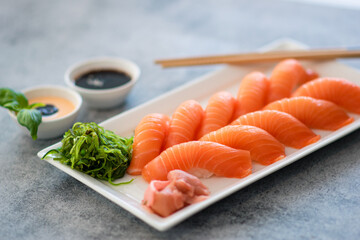 Fresh Sushi Roll with salmon.Japanese food. Copyspace black background.