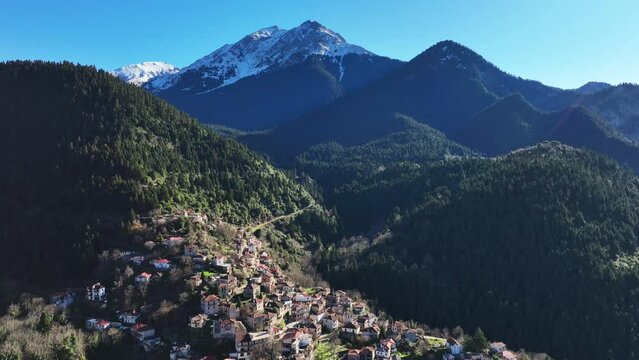 Aerial drone cinematic video of iconic small traditional village of Megalo Chorio built on a mountain slope near famous village of Karpenissi, Evrytania, Greece