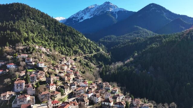 Aerial drone cinematic video of iconic small traditional village of Megalo Chorio built on a mountain slope near famous village of Karpenissi, Evrytania, Greece