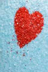 Sweet love, colorful sugar crystals, red heart shaped, valentine's day theme background. Vertical...