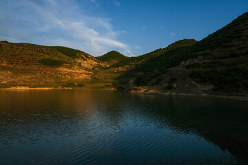 Lake of Vaqar, Albania county, Small lake, green grass.