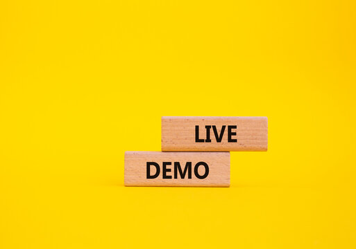 Live Demo symbol. Concept word Live Demo on wooden blocks. Beautiful yellow background. Business and Live Demo concept. Copy space