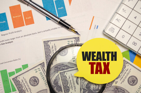WEALTH TAX on yellow sticker with pen and calculator
