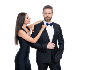 Romantic couple spending time together. Two of man and woman on valentines day. Lovely couple dating. Woman in dress and man in suit with bowtie. Elegant couple isolated on white. Advertisement