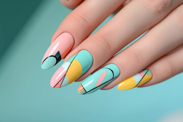 Exquisitely painted nails featuring a geometric design with pastel pink, blue, and yellow hues, showcasing the intricate art of modern manicure...