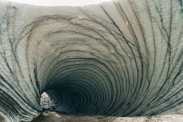 Rounded tunnel ice cave view from the inside. Cueva de Jimbo, Ushuaia, Tierra del Fuego - obrazy, fototapety, plakaty