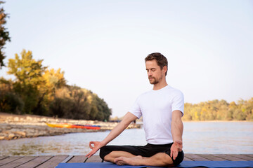 Fototapeta na wymiar Full length of man practicing yoga outdoor