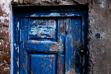 bright blue door close-up in daylight on an old building