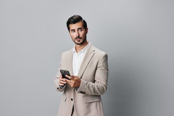 hold man happy business technology call suit phone smartphone smile portrait