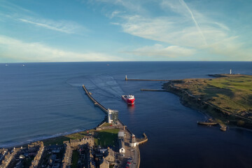 Ship arriving at Aberdeen harbour after passing Girdle Ness Lighthouse