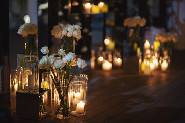 View of elegant expansive white flowers and candles decoration for wedding party. the wedding...
