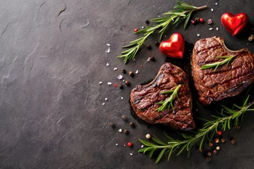 Tuinposter grilled beef steak for valentines day pragma in black background © Summit Art Creations
