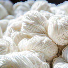 White yarn skeins close up background 