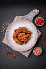 Delicious crispy potato wedges with garlic, salt, spices and herbs