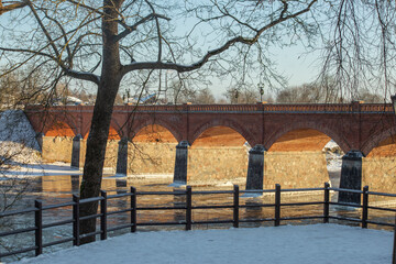 Kuldiga in winter. Old brick bridge over Venta rive. Latvia. High quality photo