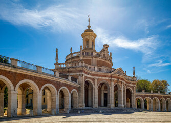 Arcade of San Antonio with the church of the same name in the center in Aranjuez, Madrid, Spain in broad light