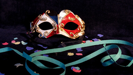 man venetian mask with confetti