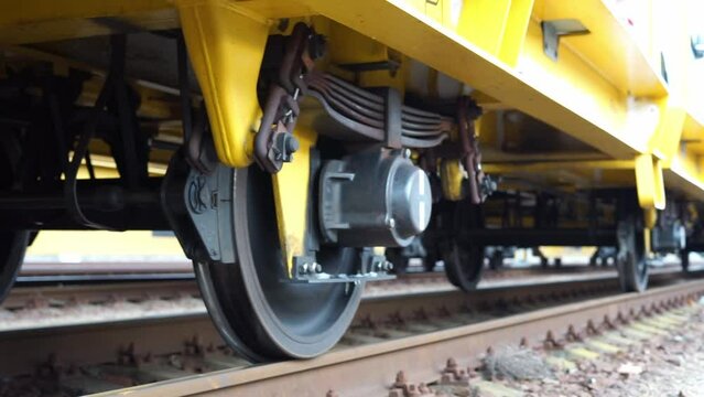 wheels of a large train carriage on the rails