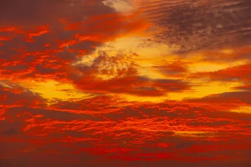 Fotobehang Attractive dramatic red sunset with cloudy sky © Elena