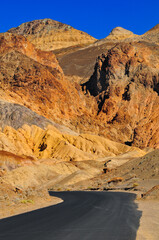 The Artists Drive scenic road winding through multi-coloured geology, Death Valley National Park, California, USA.