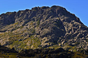 Pico das Agulhas Negras (2.791m), or Black Needles Peak, one of the highest in Brazil, towering above the boulder-filled high sector of Itatiaia National Park, Itatiaia, Rio de Janeiro, Brazil.