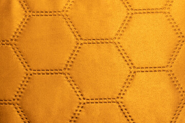 Orange velvet fabric patterned with hexagons resembling soccer ball texture