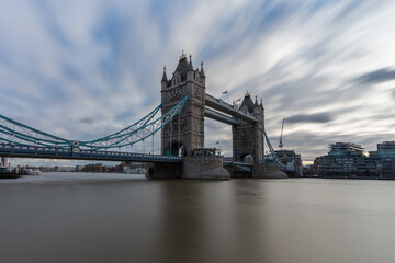 Fototapeta na wymiar View of tower bridge, London over river Thames in long exposure