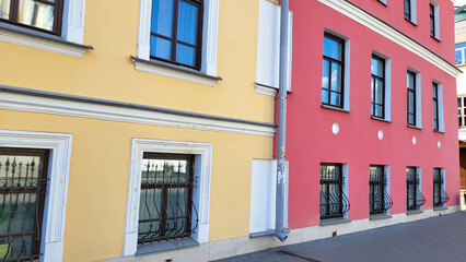View of the facades of multi-colored multistorey residential buildings. Fragment of a multi-storey residential building.
