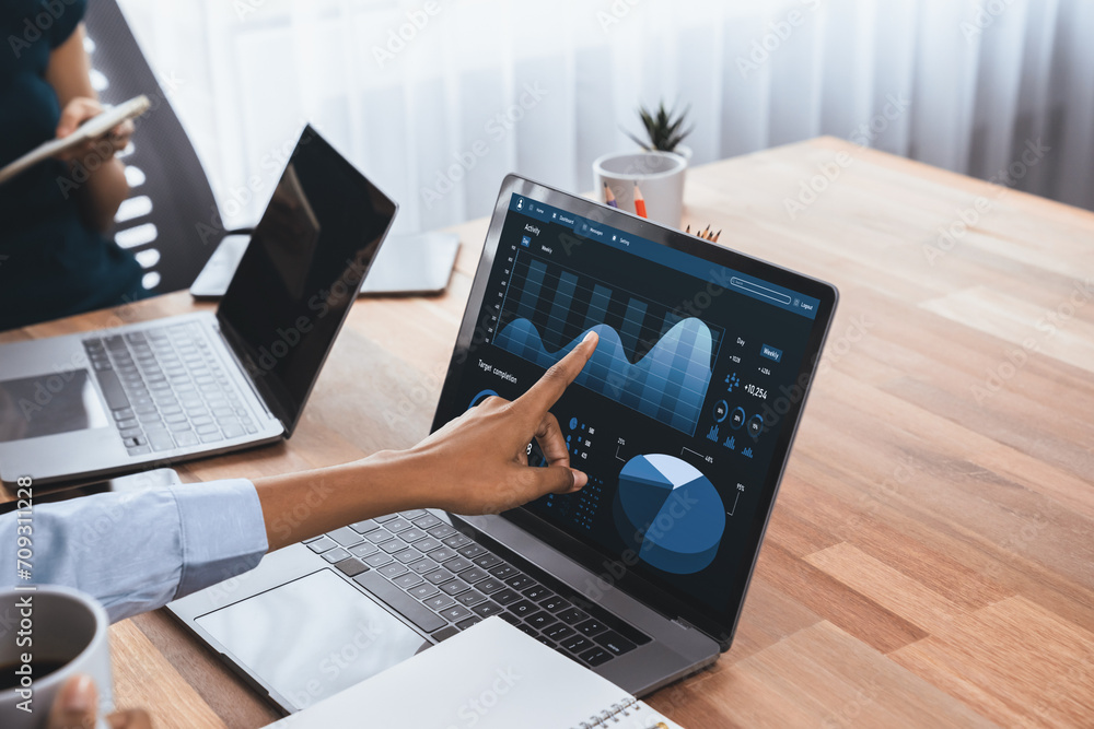Poster multiracial analyst team use bi fintech software to analyze financial data on meeting table. financi