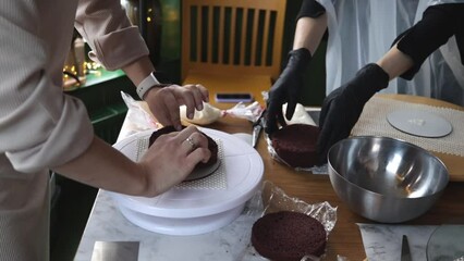 The process of making a cake in the kitchen. Conducting a master class for confectioners
