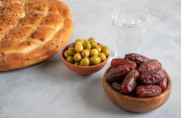 Traditional iftar table with dates, pita, green olives
