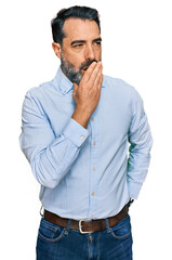 Middle aged man with beard wearing business shirt bored yawning tired covering mouth with hand. restless and sleepiness.