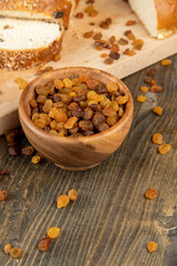 sweet bun with golden raisins, closeup