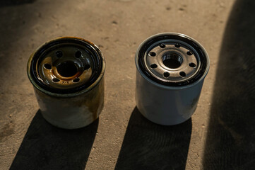 Old and new car oil filter. No people. 