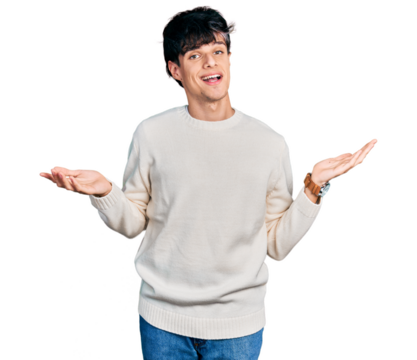 Handsome hipster young man wearing casual winter sweater clueless and confused expression with arms and hands raised. doubt concept.