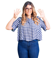 Young caucasian woman wearing casual clothes showing and pointing up with fingers number nine while...