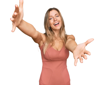 Beautiful caucasian woman wearing casual clothes looking at the camera smiling with open arms for hug. cheerful expression embracing happiness.