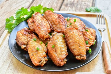 Fried chicken ,Fried chicken wing, on a black plate, top view food